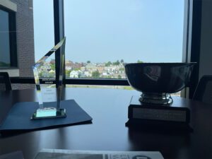 Blog - Award Trophies Sitting on a Desk in Front of a Window on a Nice Day Inside