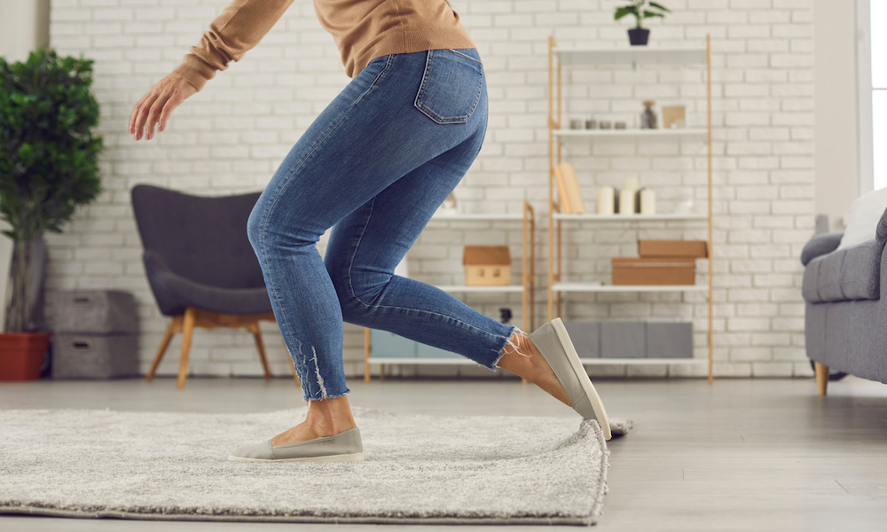 How to Help Prevent Slip and Falls at Home – Some commonsense tips! - Women Tripping On Her Rug In The Living Room